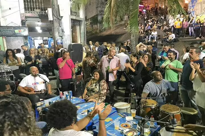 Lively street samba performance in Rio with musicians and a vibrant crowd enjoying the city's nightlife.
