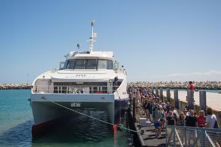 Tourists boarding a ferry to Robben Island from Cape Town, a highlight of the full-day Cape of Good Hope tour.