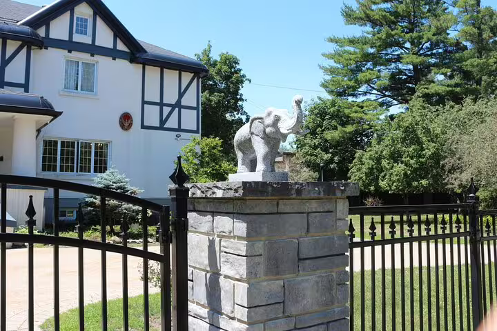 Stone gate pillar with elephant sculpture at Rockcliffe Park Ottawa mansion entrance