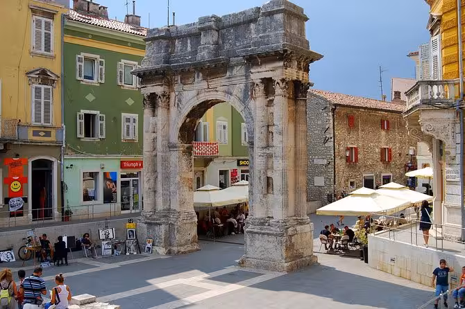 Roman Arch of the Sergii in Pula old town square, a highlight of Magical Istria Pula & Rovinj tour from Zagreb