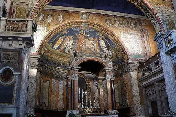 Ancient golden mosaic apse and ornate altar inside a historic Roman basilica on the Monti sightseeing tour