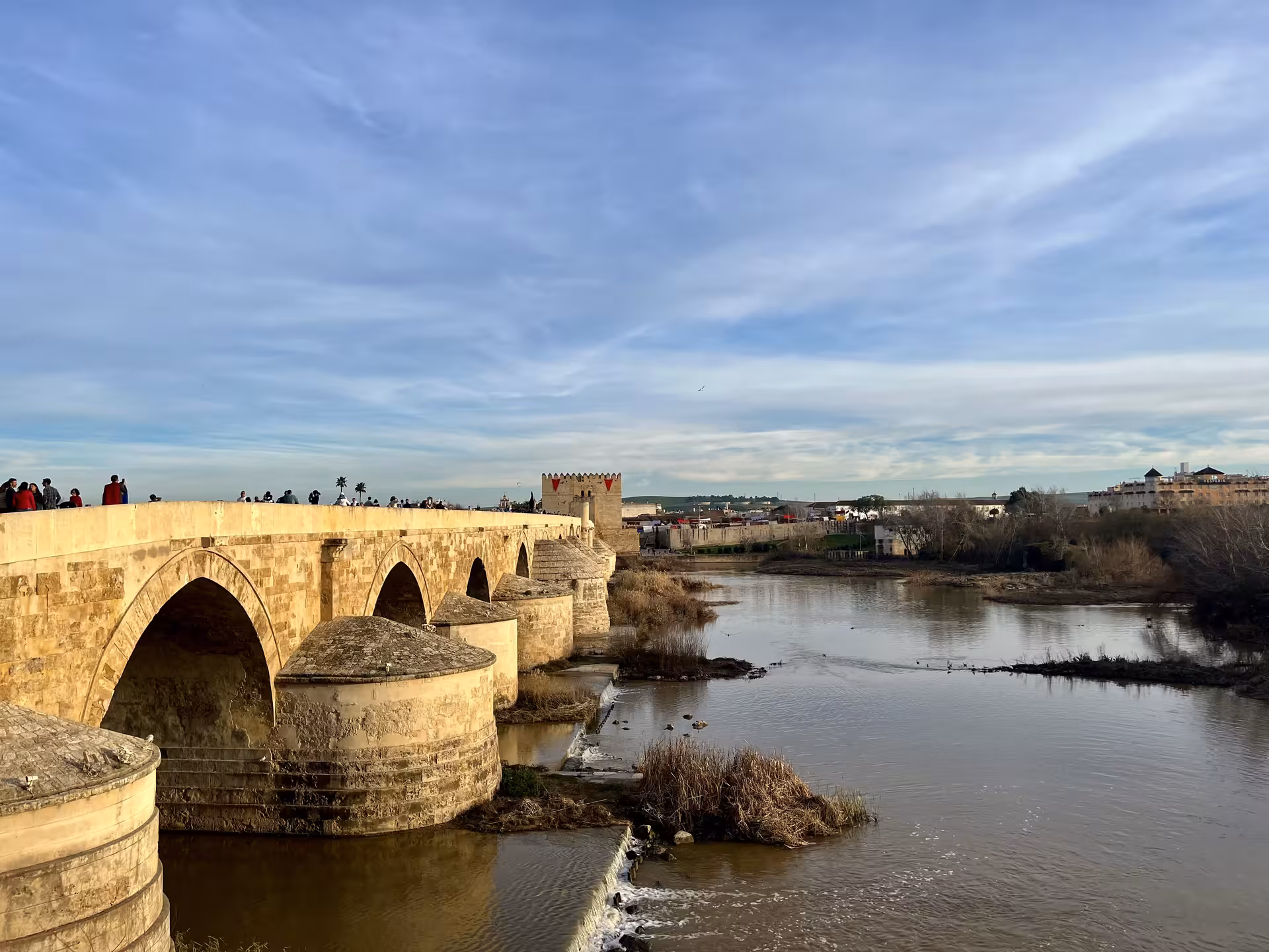 Roman Bridge of Córdoba over the Guadalquivir, key stop on Misterios Locales tour near historic old town