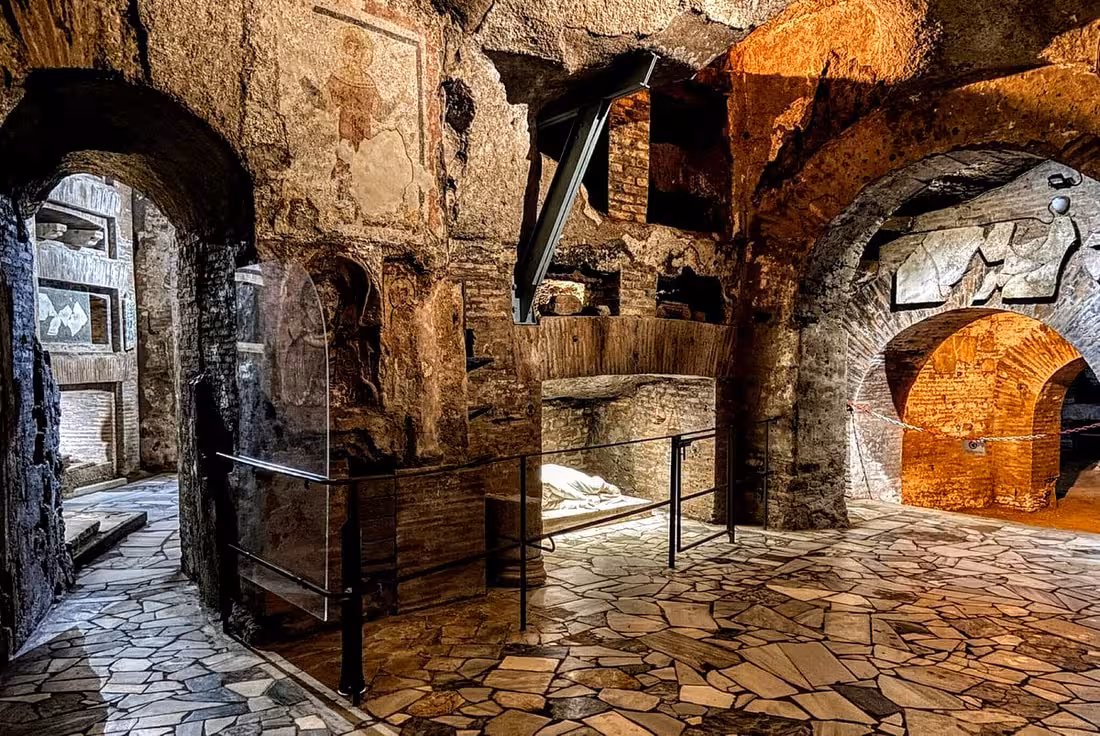 Discover ancient frescoes and stonework in the historic Roman catacombs on a private tour with driver.