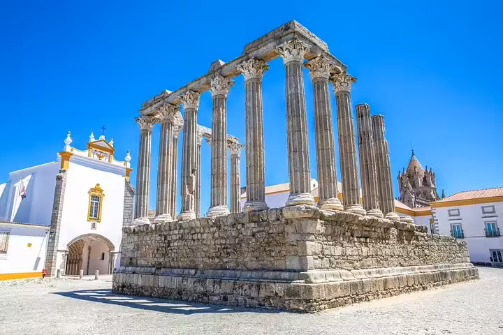 Roman Temple of Évora under blue sky, highlight stop on Faro to Lisbon private transfer with 2-hour tour