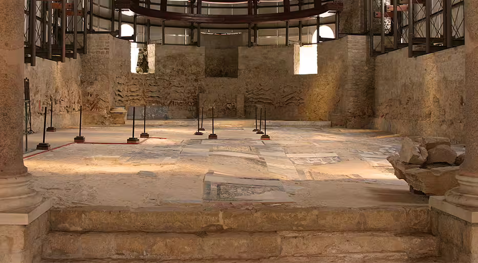 Roman Villa del Casale interior with ancient mosaic floors, key stop on Palermo to Taormina tour