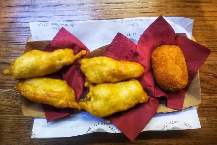 Savor traditional Roman suppli and fritti on the Roman Walkin Foodies Tour, highlighting authentic Italian street food.