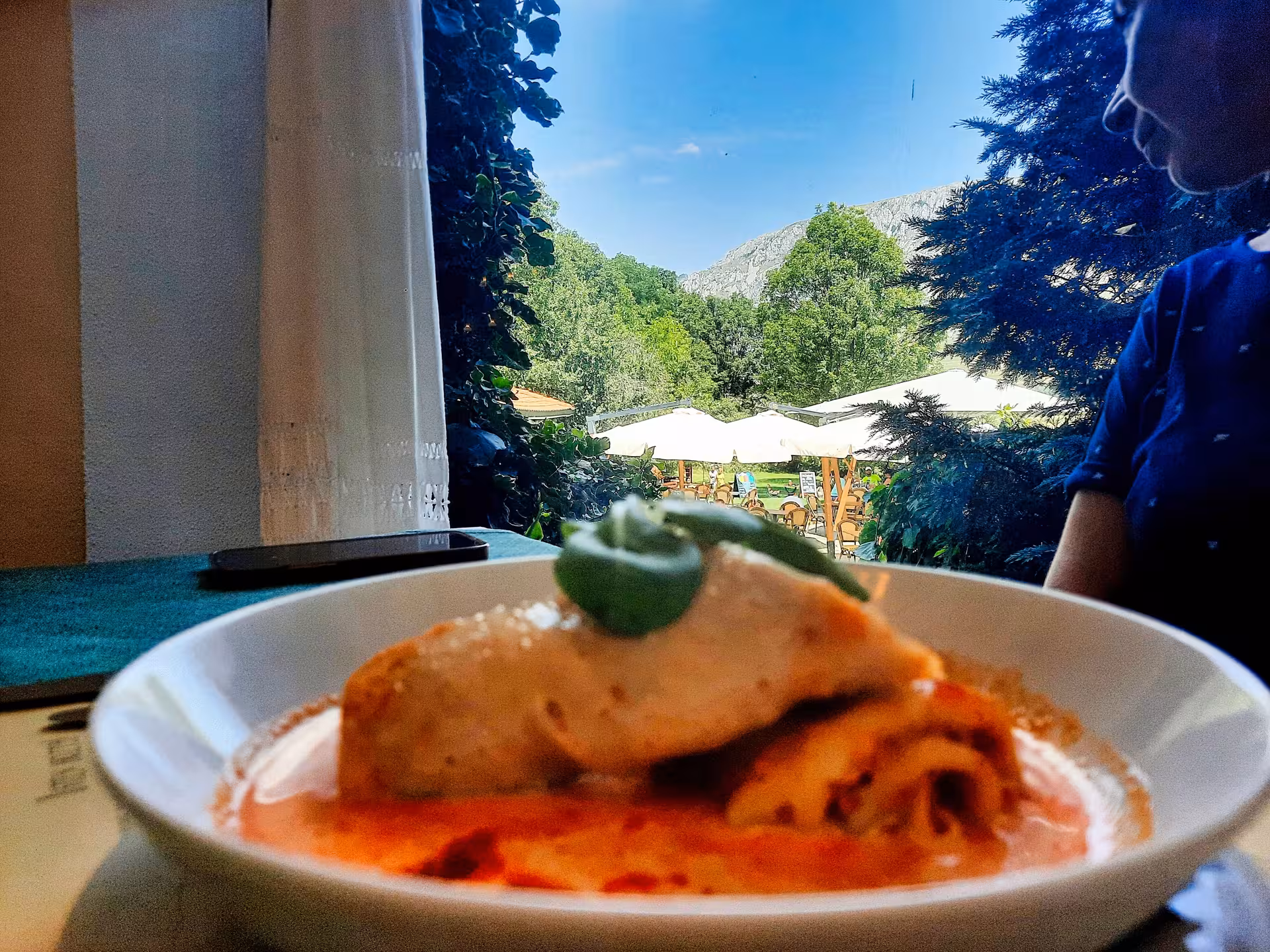 Delicious Romanian crepes served at a restaurant near Turda Gorge with stunning mountain views backdrop
