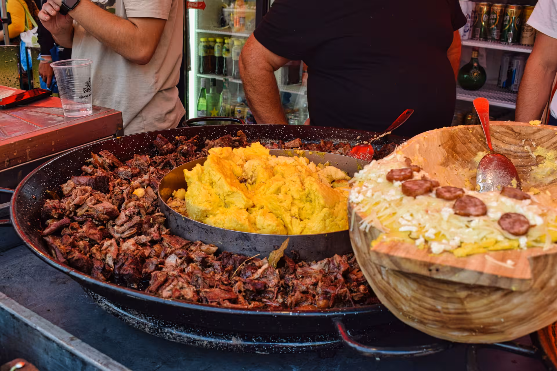 Traditional Romanian street food with braised meat polenta and sausages served at Negreni Flea Market tour