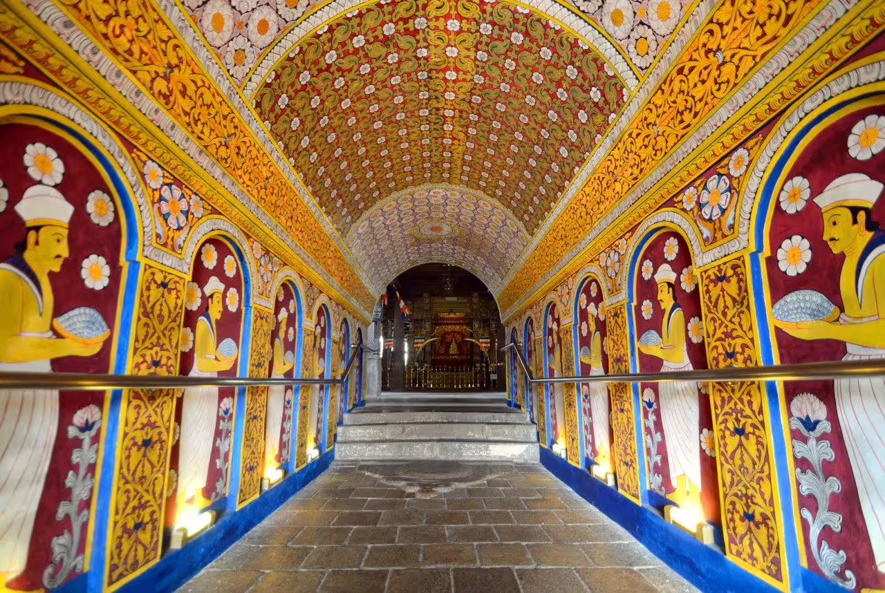 Vibrant, ornate hallway with intricate murals, perfect for a romantic escape private tour experience.