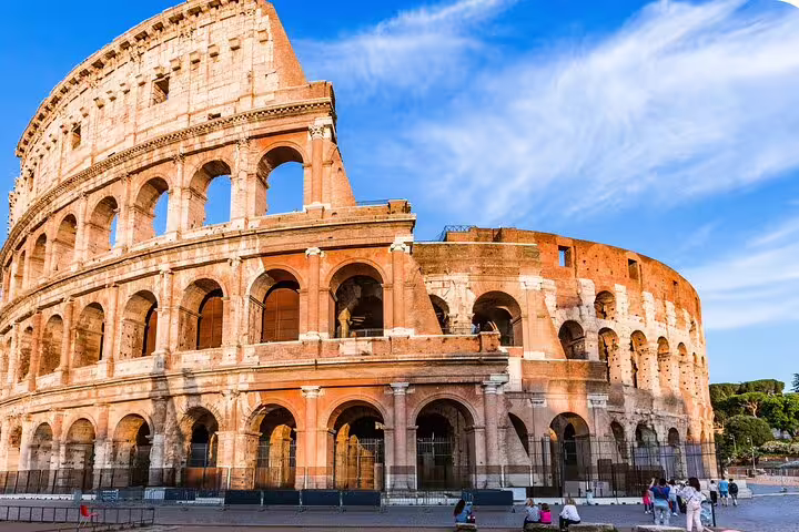 Iconic ancient Roman Colosseum exterior on a sunny day, a key stop on the Rome self-guided audio tour.