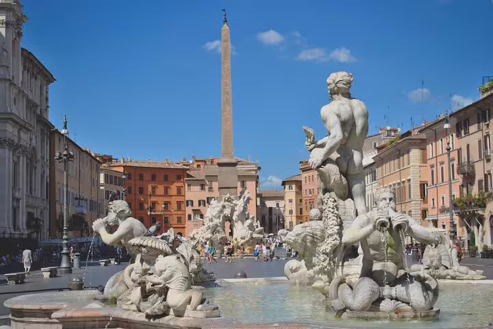 Families explore Rome's Piazza Navona, enjoying its fountains and historic charm on a fun-filled private tour for kids.