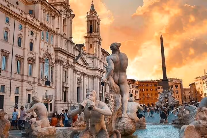 Stunning view of Piazza Navona's fountains and architecture during a sunset golf cart tour in Rome with free pick-up.