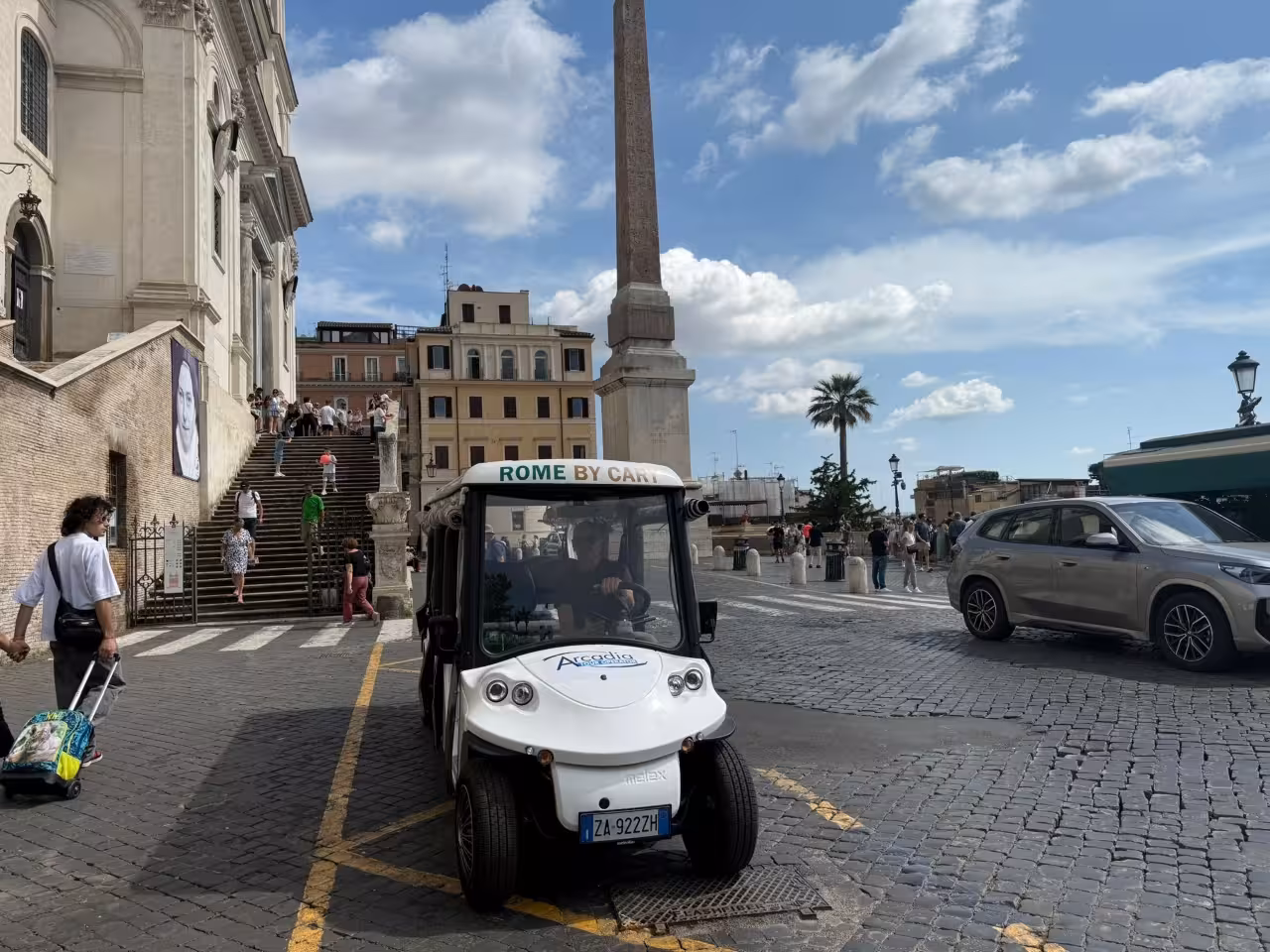 Rome golf cart tour at Piazza del Popolo near the obelisk, starting point for Gianicolo and Trastevere ride