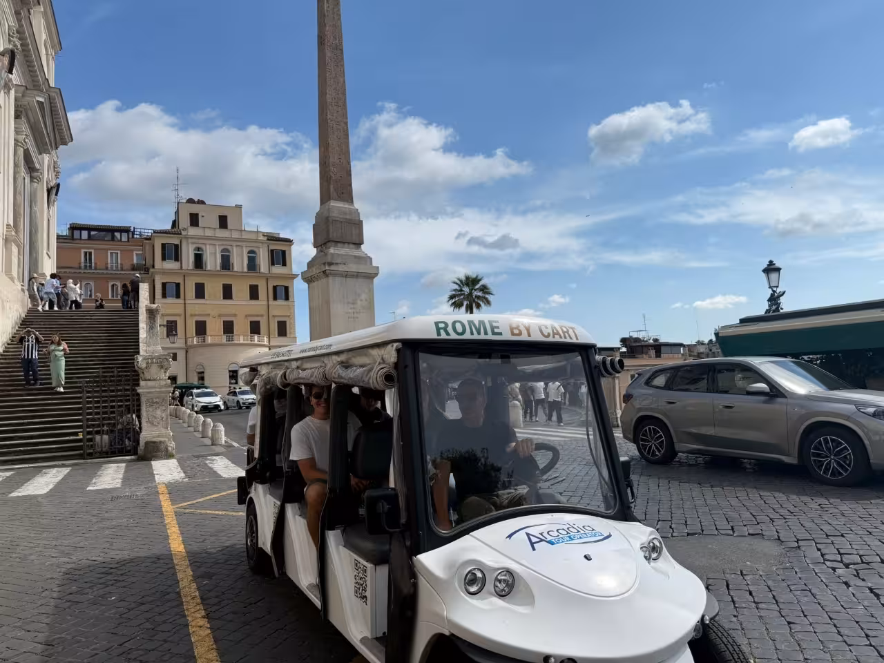 Rome city center golf cart tour at Piazza di Spagna near the Spanish Steps and ancient obelisk