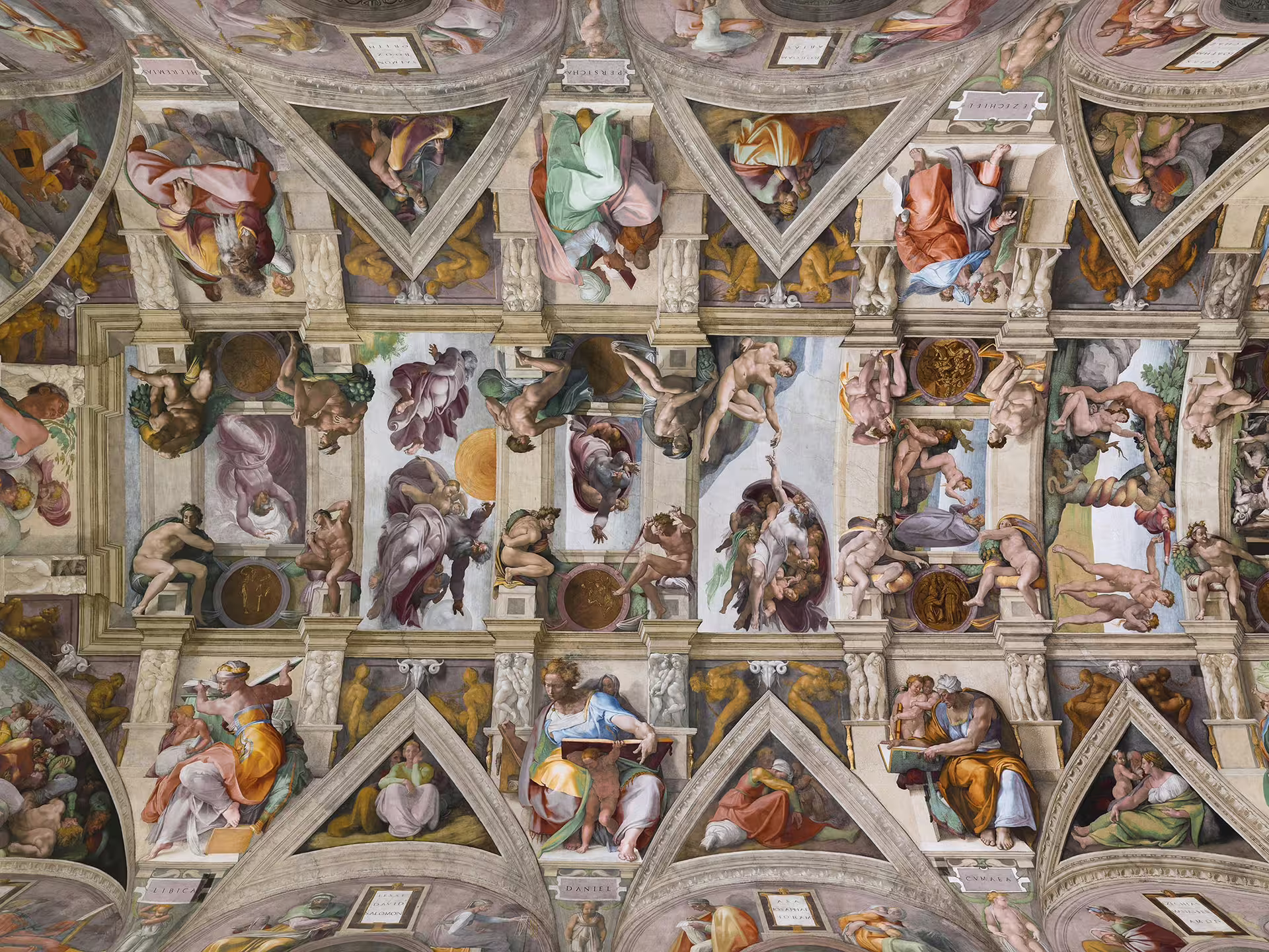 Panoramic view of Michelangelo’s frescoes on the Sistine Chapel ceiling, a highlight of the Rome hop on hop off bus and Vatican Museums tour