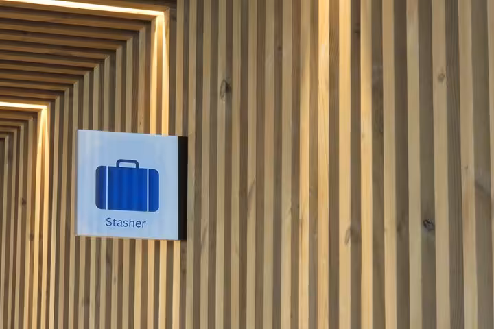 Stasher luggage storage sign inside secure drop-off point near Vatican Museums Rome for travelers