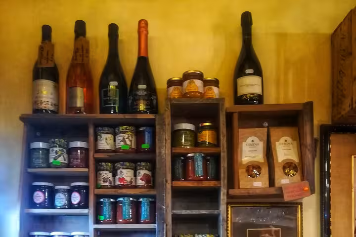 Cozy Italian shop in Pigneto, Rome, showcasing artisanal products and craft beer selections for tour visitors.