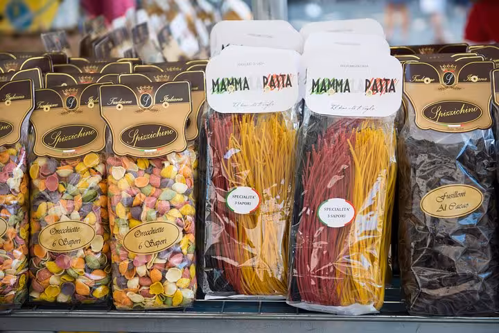 Colorful artisan pasta varieties on display at a local market in Rome's Rione Parione during a food tour.
