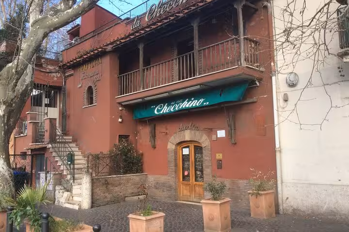 Charming trattoria exterior in Rome's Testaccio district, a highlight on the private food tour exploring local cuisine.
