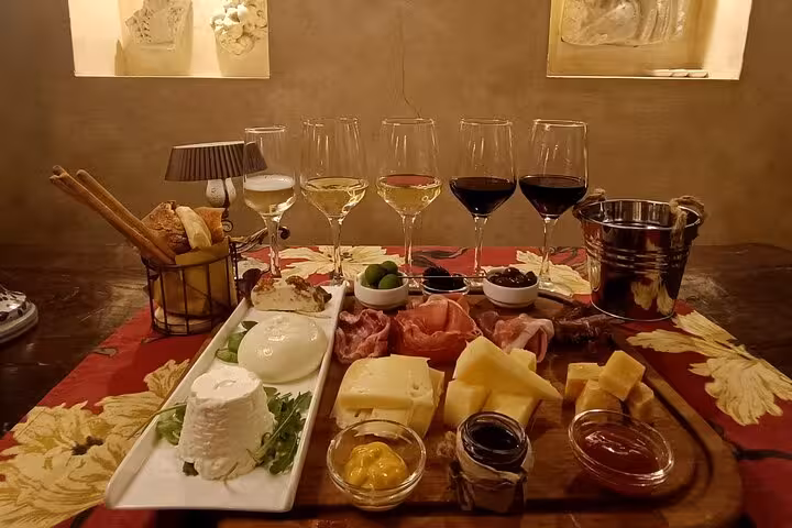 Gourmet Italian cheese and charcuterie board with wine pairing in a cozy Rome Trastevere tasting room