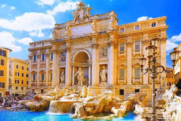 Trevi Fountain in Rome on a sunny day, a highlight stop on a private chauffeured city tour with wine and food tasting