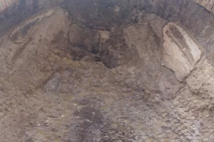 Explore ancient Roman walls on the Rome Underground Tour, revealing hidden layers of history beneath the city.
