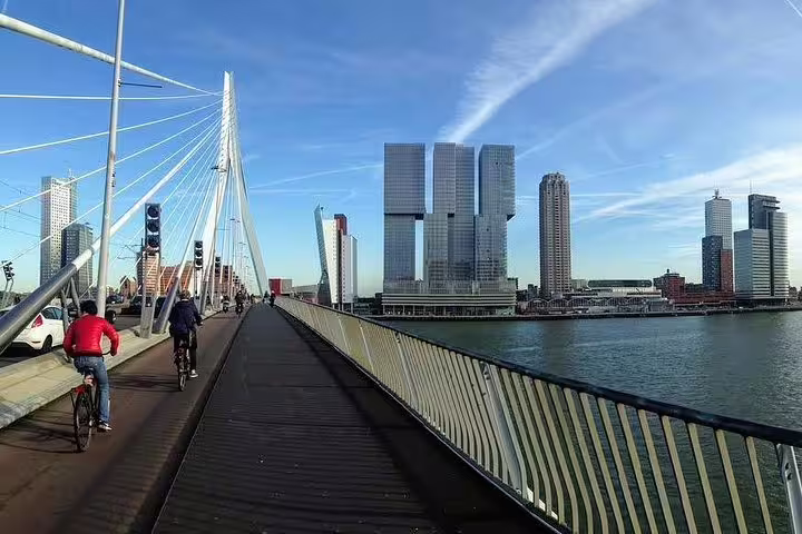 Erasmus Bridge walkway with Rotterdam skyline and river views, featured on the Future-focused walking tour