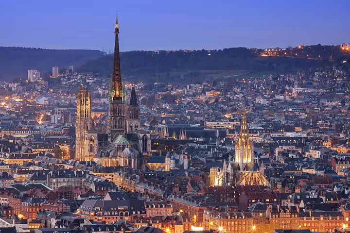 Twilight skyline of Rouen with Rouen Cathedral spires, Normandy highlight on a private tour from Paris