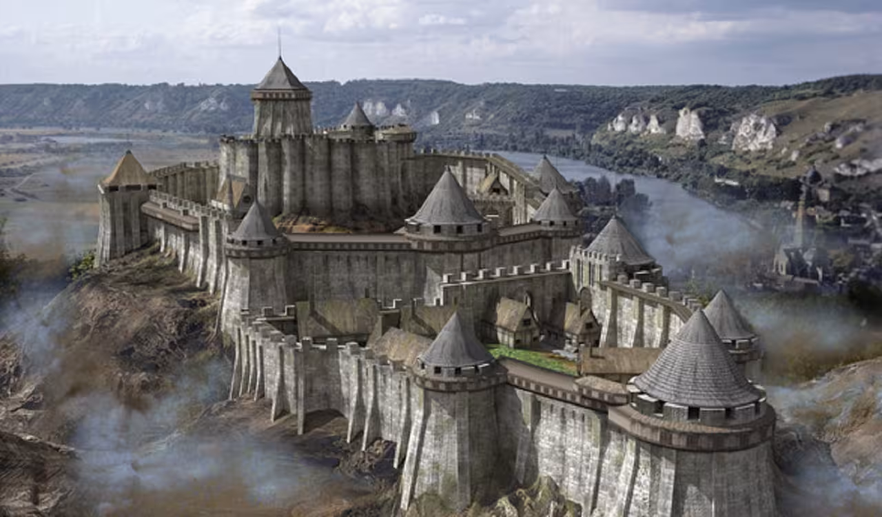 Medieval castle with multiple towers and battlements perched on a cliff overlooking a winding river valley