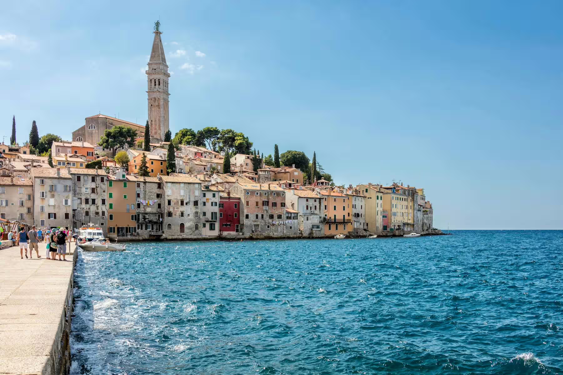 Rovinj waterfront view on Istrian coast boat cruise from Poreč, colorful old town and church tower