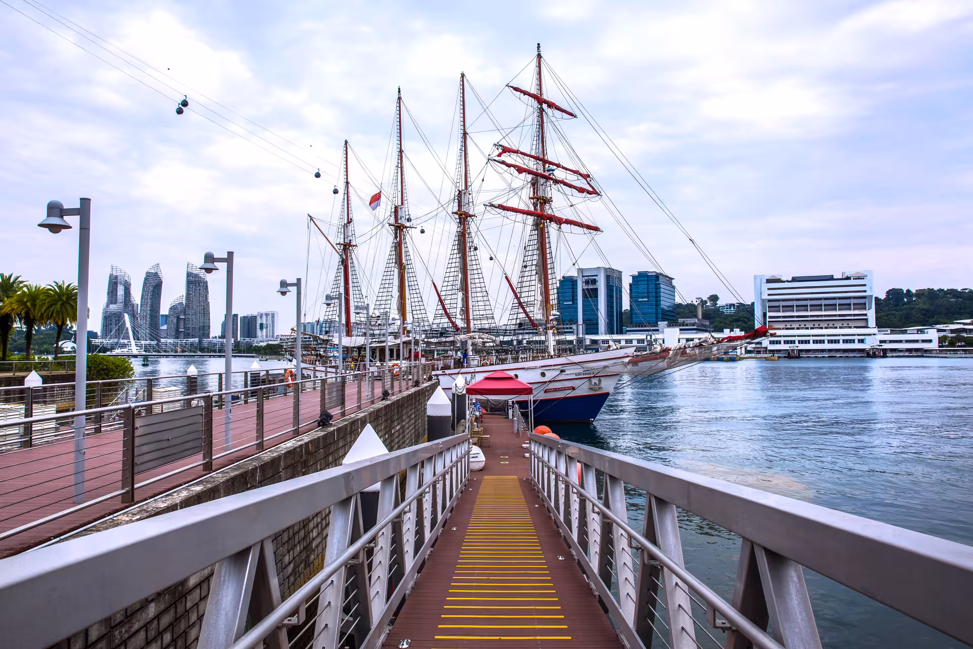 Royal Albatross docked at a Singapore pier, ready for a memorable dog-friendly breakfast cruise adventure.