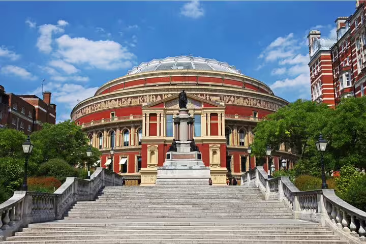 Royal Albert Hall with grand staircase and statue, London landmark on a sunny day