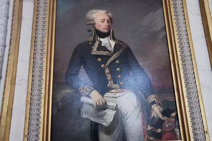 Framed royal portrait inside Versailles Palace, a highlight on guided tour with skip-the-line tickets