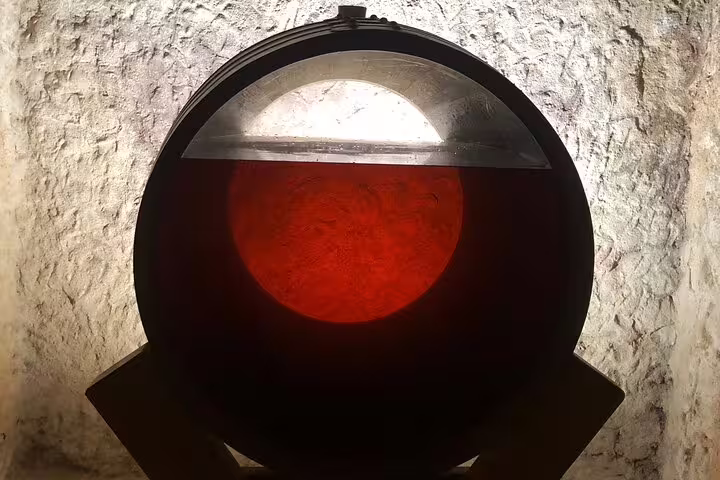 Illuminated wine barrel showcasing rich red hues, featured in the Rueda wine tour from Madrid.