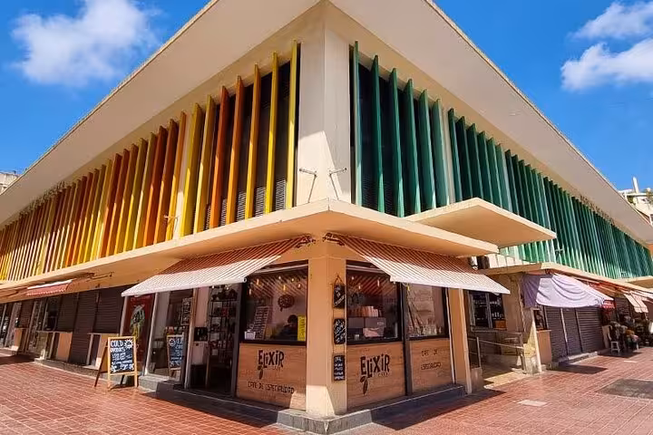 Ruzafa Valencia market-style corner bar with colorful facade, featured on evening food and wine tapas tour