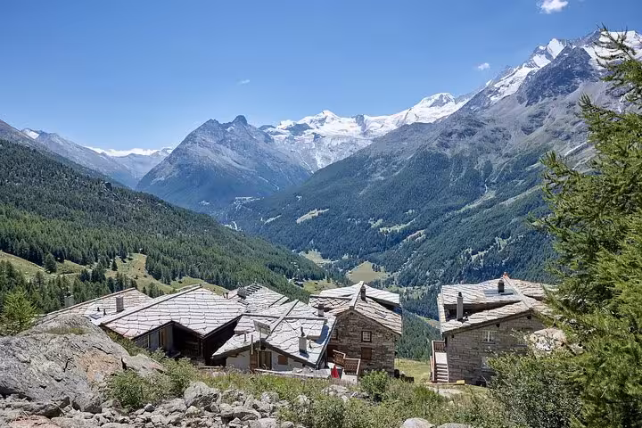 Traditional Saas-Fee chalets with sweeping Alpine valley views on Zurich day trip to Allalin and Mittelallalin