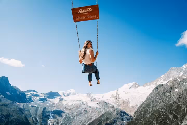Traveler on Saas-Fee Glacier Swing with panoramic Swiss Alps, a hidden gem near Zermatt tour