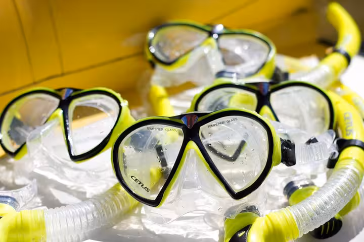 Bright snorkel gear ready for use on Saco Mamanguá Fjord's pristine beaches and crystal-clear waters tour.