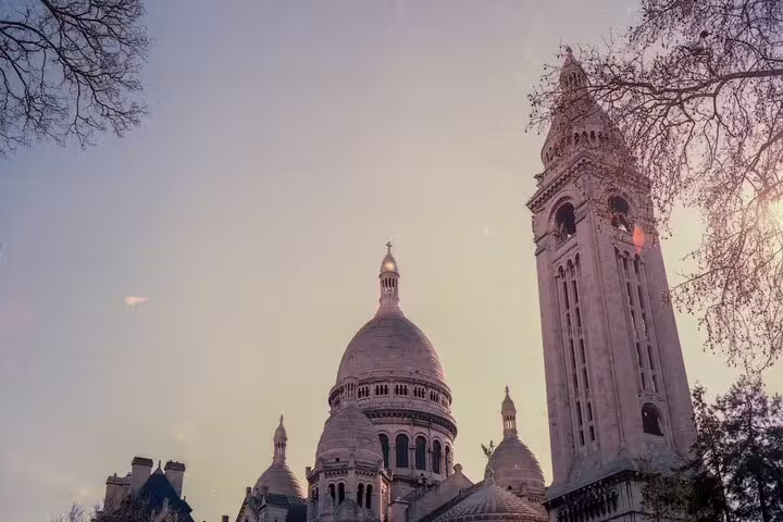 Sacré-Cœur Basilica dome and bell tower at dusk in Montmartre, Paris