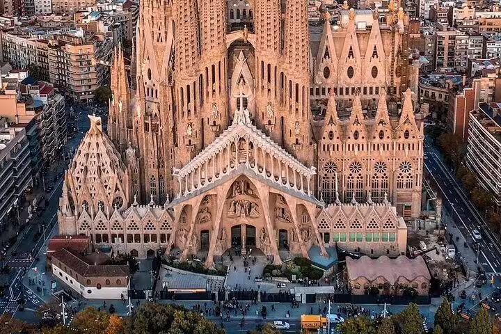 Aerial view of Sagrada Família basilica and surrounding Barcelona cityscape on a clear day