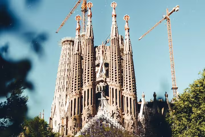 Stunning view of the iconic Sagrada Familia's intricate spires under construction, a highlight of Barcelona tours.