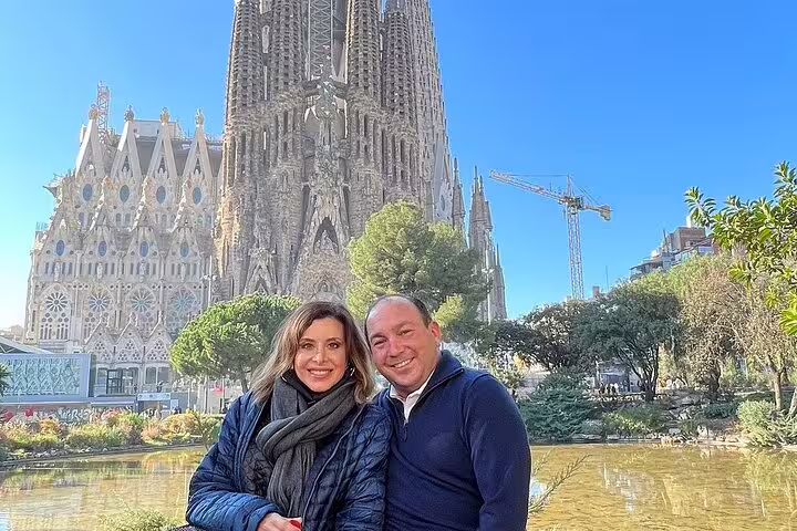 Visitors enjoying a sunny day at Sagrada Familia, highlighting its stunning architecture during a Barcelona tour.