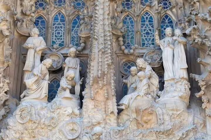 Close-up of ornate Nativity façade sculptures on Barcelona’s Sagrada Familia, explored on an insider priority access tour