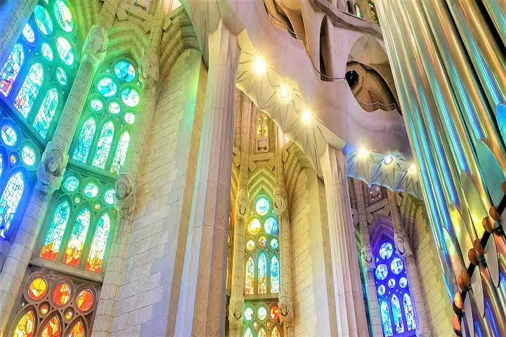 Vibrant stained glass windows inside Sagrada Familia, showcasing the breathtaking interior of Barcelona's famous basilica.