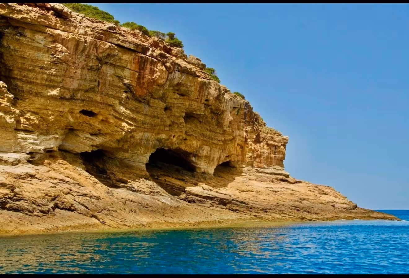 Close-up view of dramatic layered sandstone sea caves along Sagres coastline on a Lagos boat adventure tour