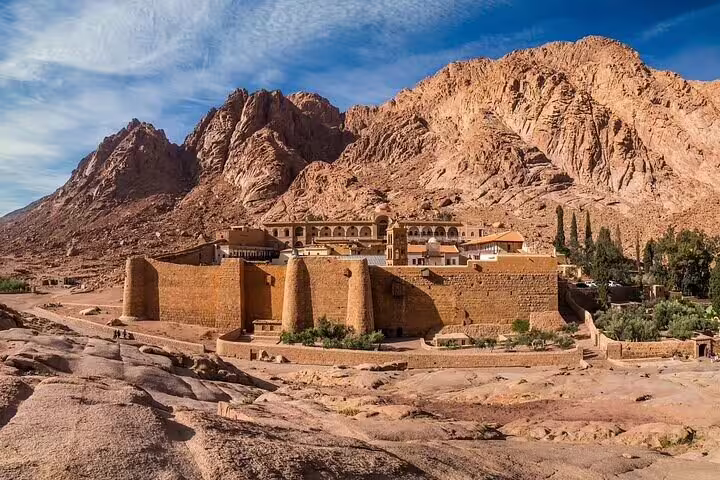 Panoramic view of Saint Catherine’s Monastery beneath Sinai mountains, part of Dahab day tour from Sharm El Sheikh