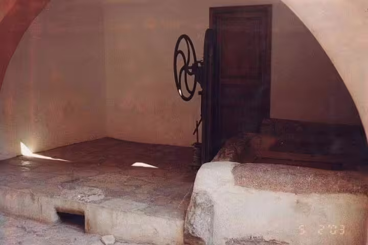 Ancient olive press inside Saint Catherine’s Monastery, a highlight on Dahab day tour from Sharm El Sheikh