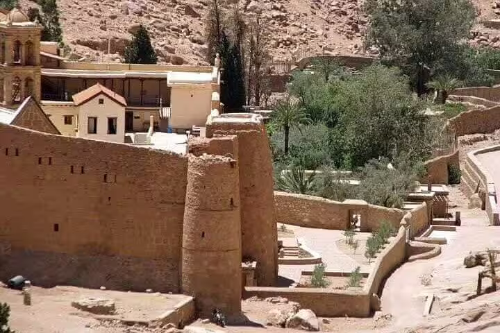 Stone walls and gardens of Saint Catherine’s Monastery in Sinai, visited on Sharm El Sheikh to Dahab day trip