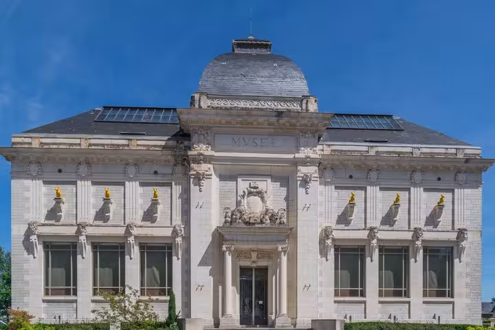 Neoclassical museum building with dome and ornate facade in Saint-Etienne, France