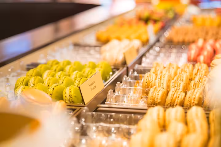 Assorted colorful macarons on display during the Saint-Germain chocolate and pastry walking tour.